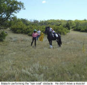 Performing the "Rain Coat" obstacle